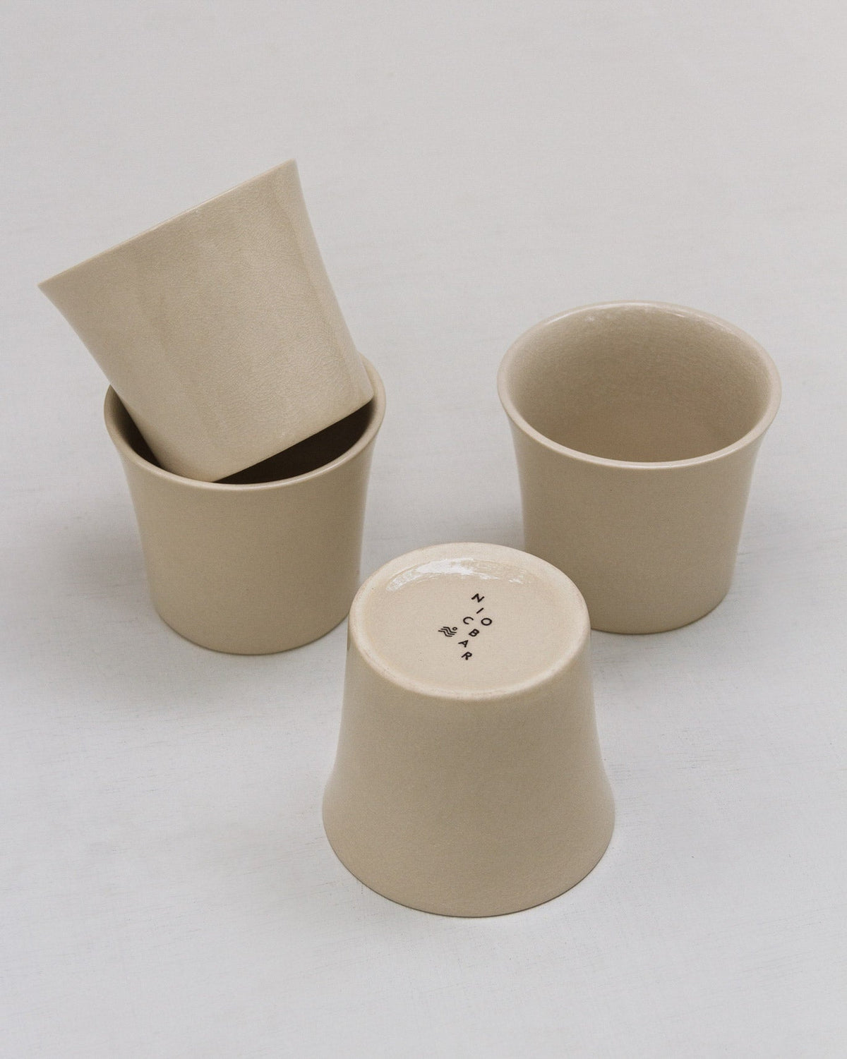 Colombo Teacup (Set of 4) seen from different angles, with one upside down.