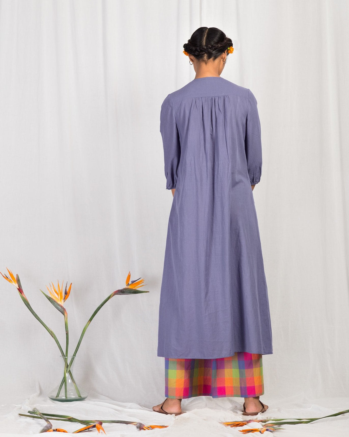 Back of blue Front Pleat Kurta worn by a person.