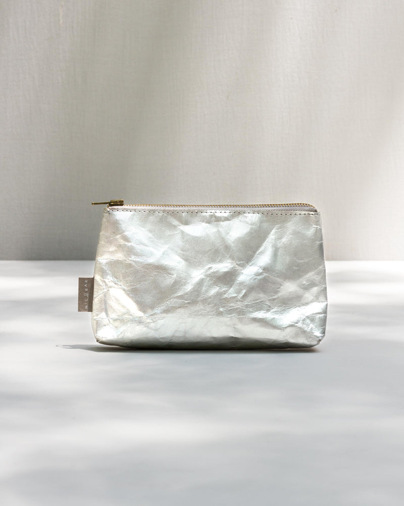 Silver Paper Pouch (Small) with a gold zip along the top.