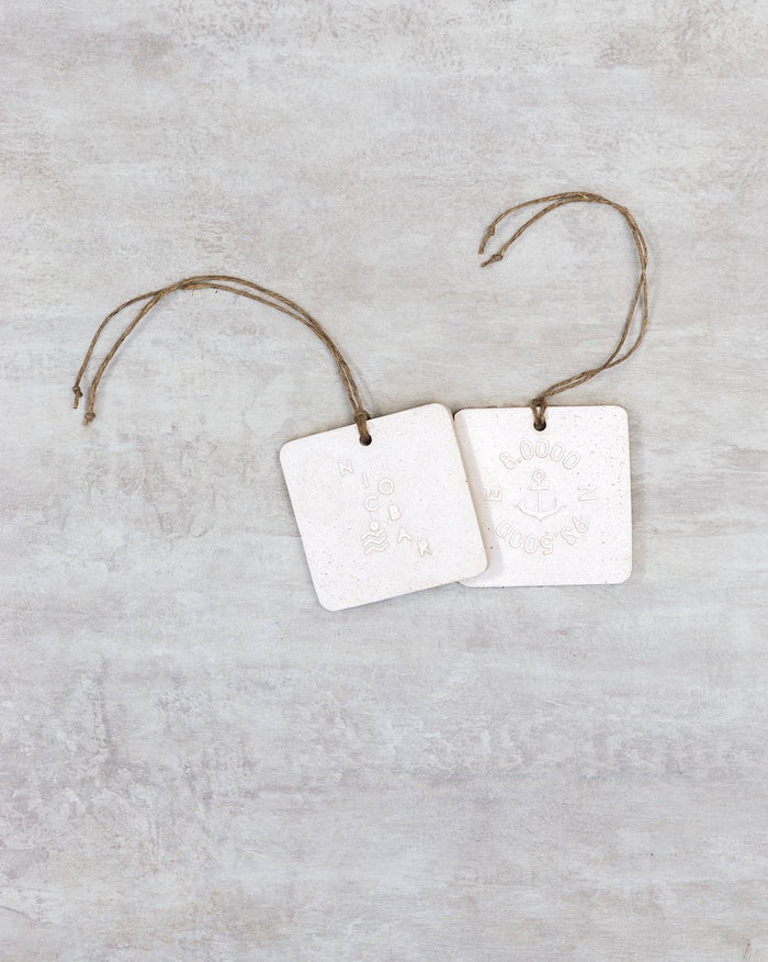 Pair of 2737 BC Ceramic Tiles hung on jute twine.
