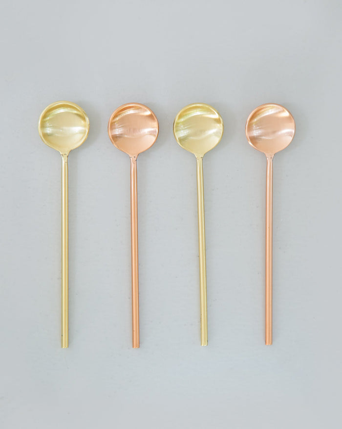 Coffee Spoons (Set of 4) laid in a row, with round bowls in gold and copper.