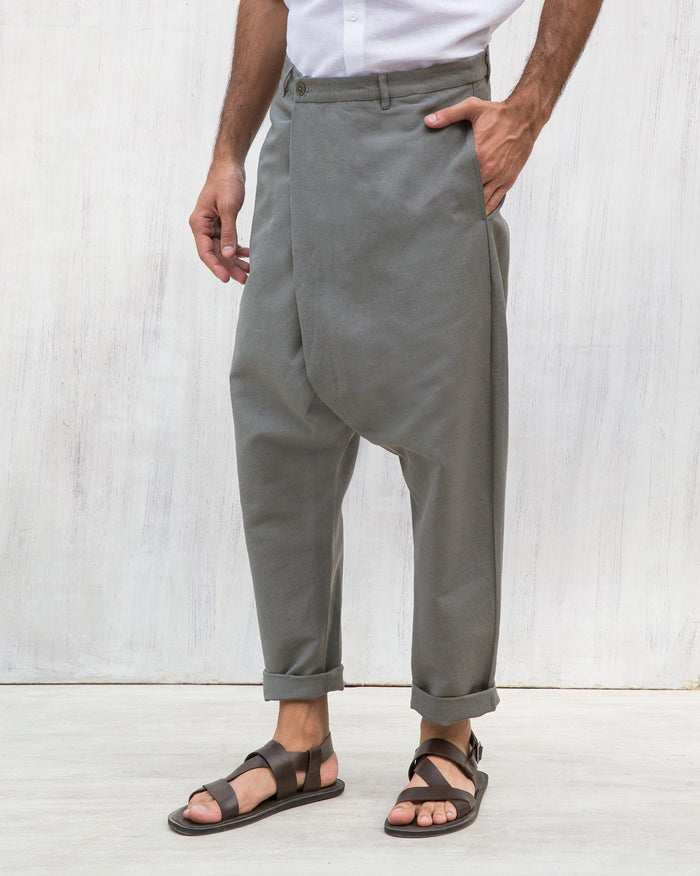 Person wearing Slouchy Pants with a drop crotch and turned-up cuffs.