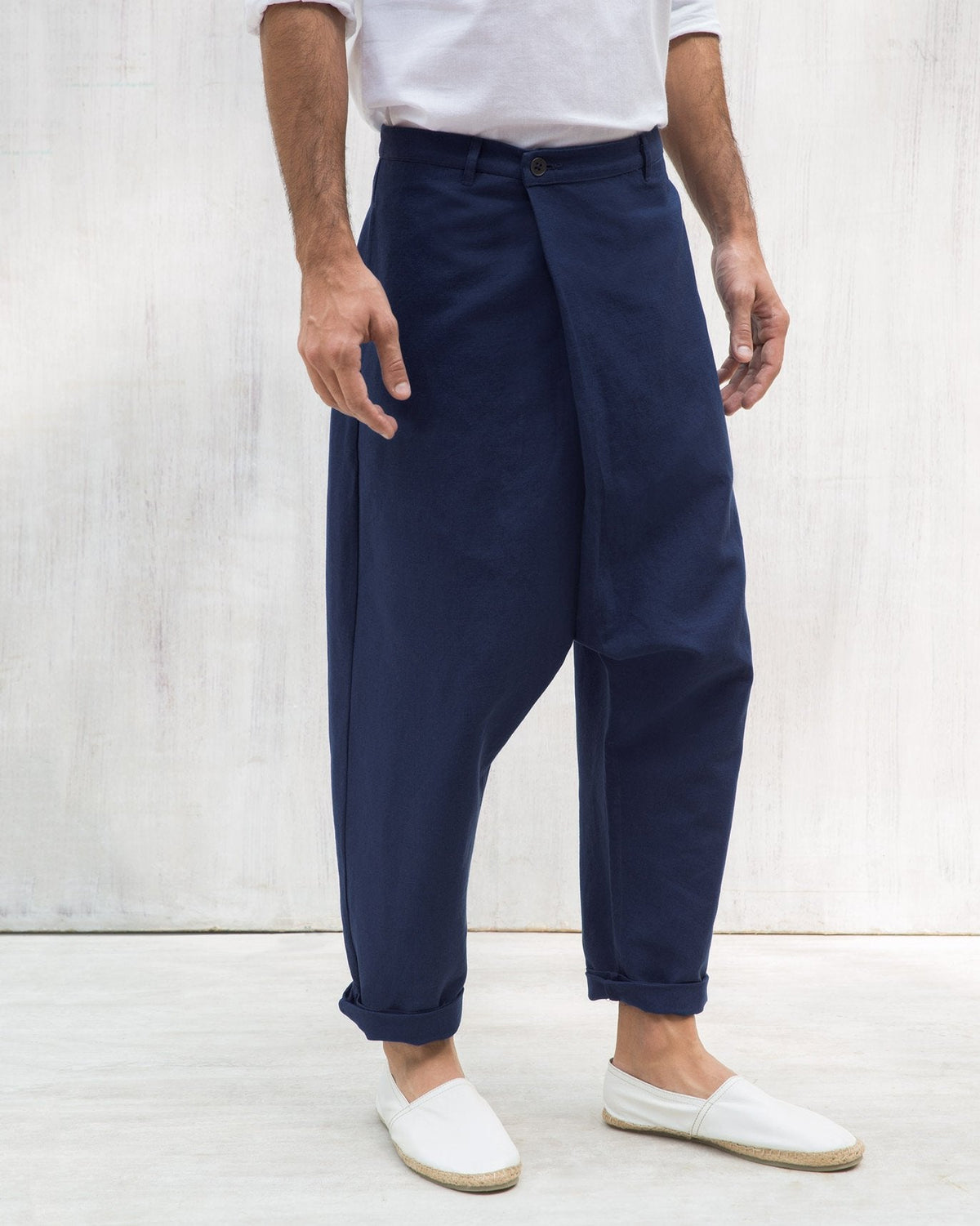 Blue Slouchy pants showing the wrap-front panel and cuffed hems.