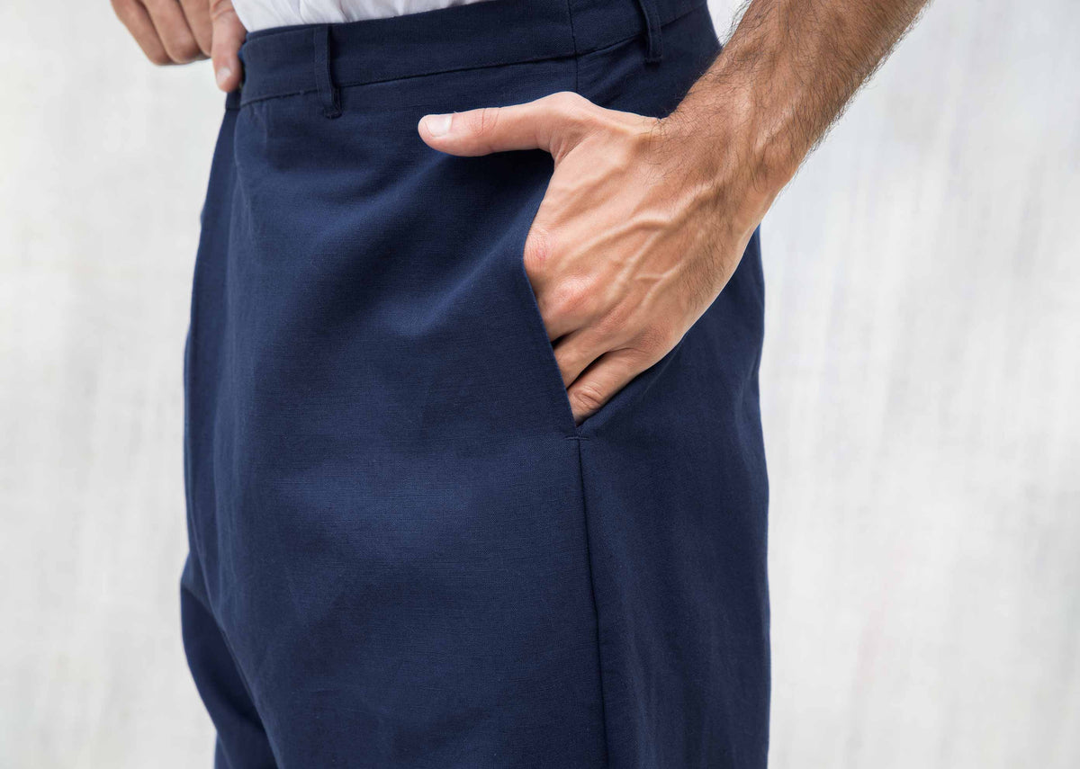 Close-up of blue Slouchy pants showing the side pocket.