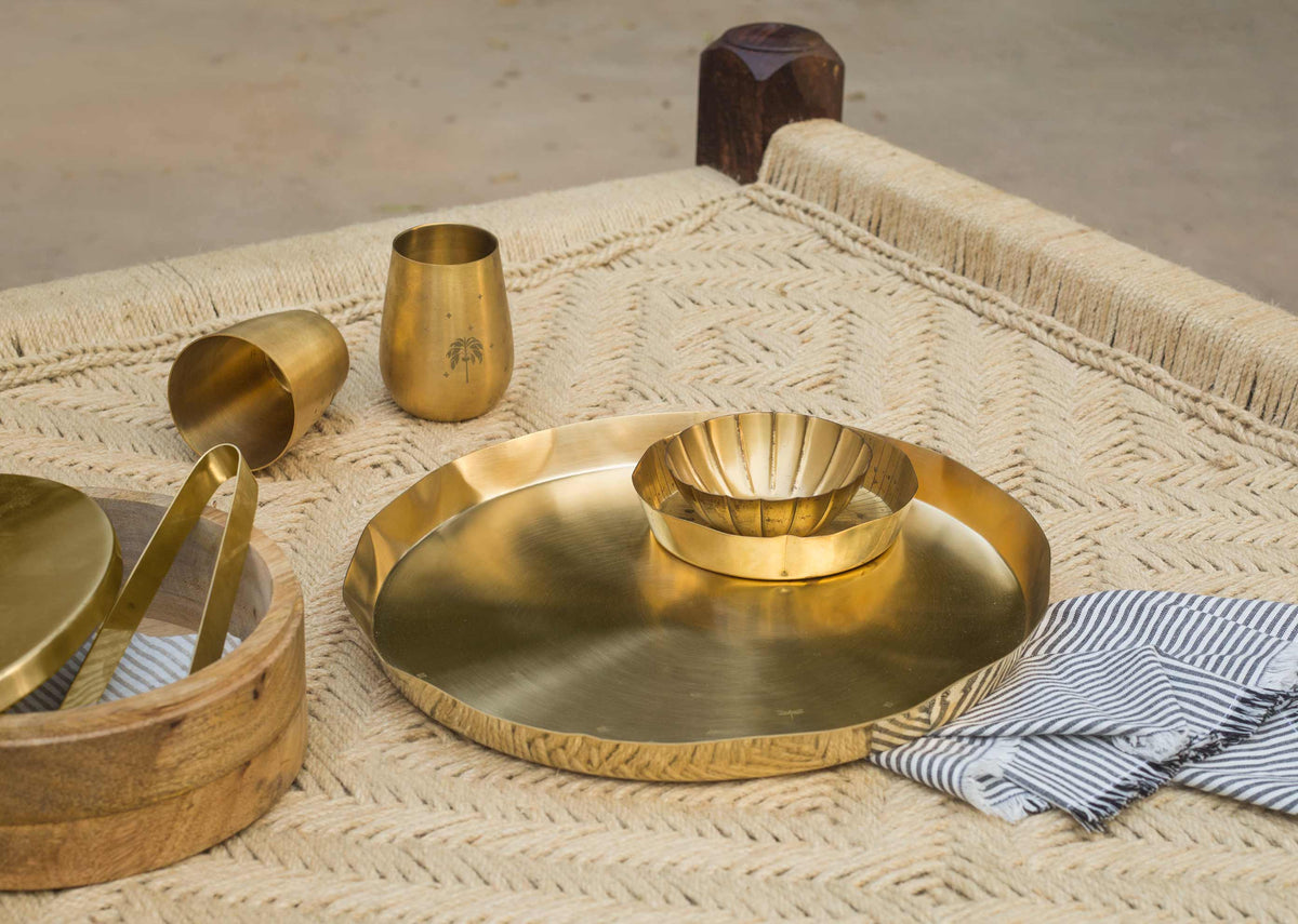 Lotus Leaf Brass Thali with a small brass bowl placed on top.