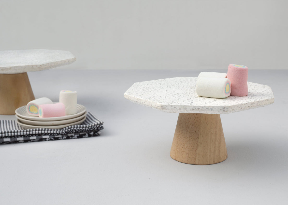 Colombo Cake Stand - Small with pink and cream cups on its speckled top.