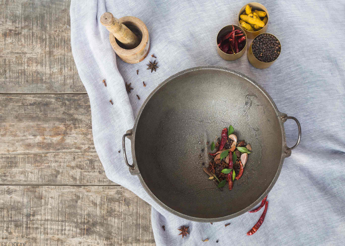 Overhead view of the Cast Iron Kadai with spices in the pan.