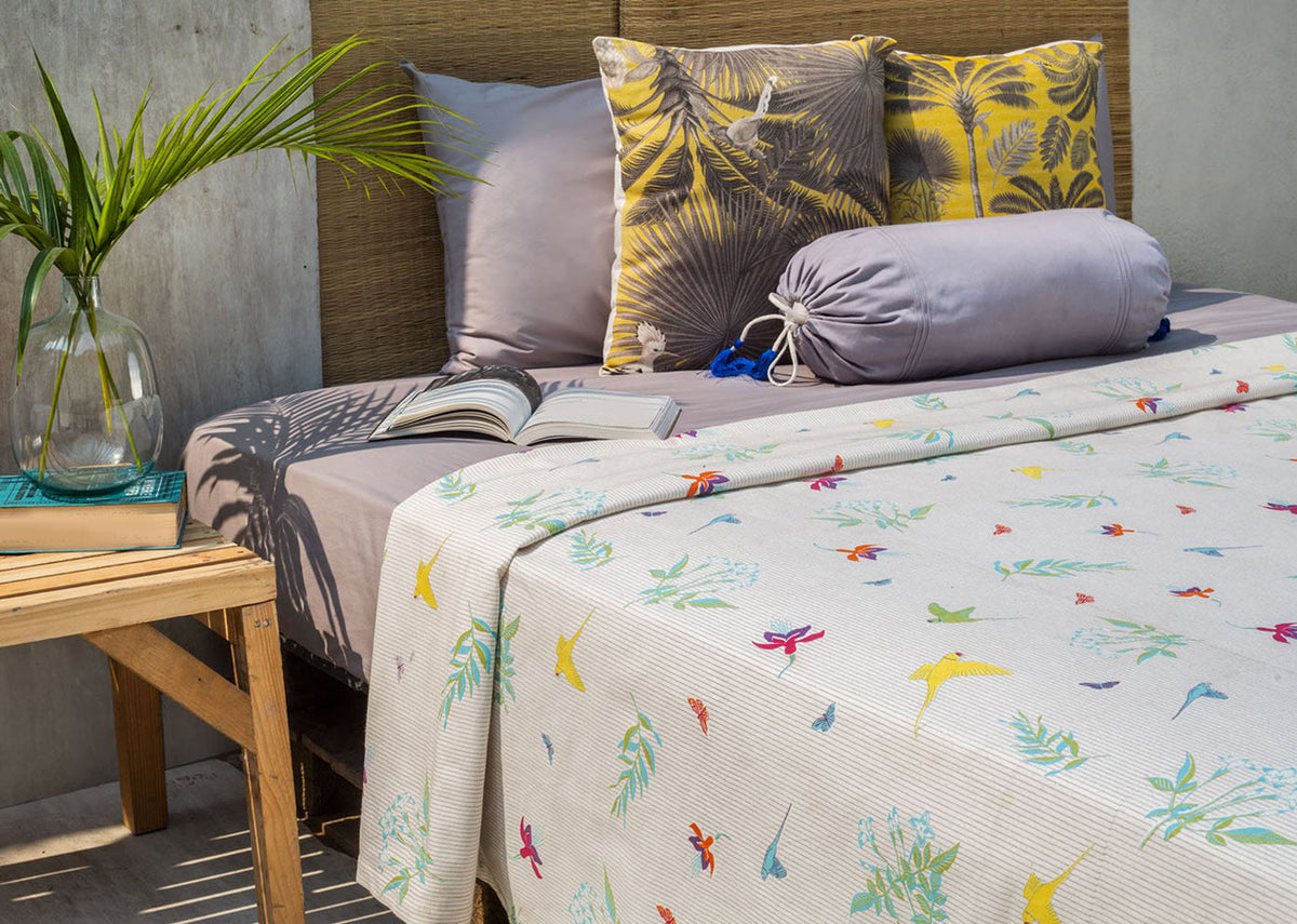 Botanical Bed Cover draped over a made bed.