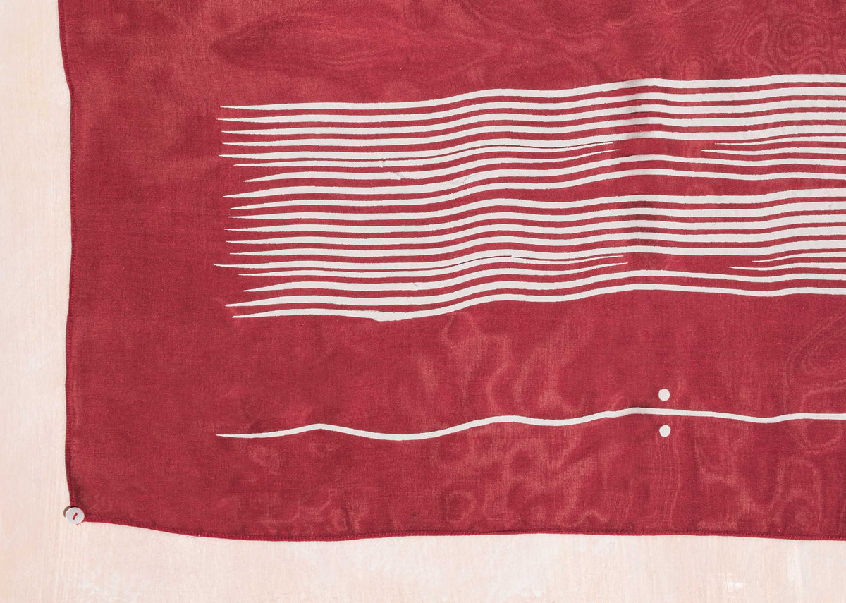 Close-up of the Illustration Scarf showing white stripes on red.