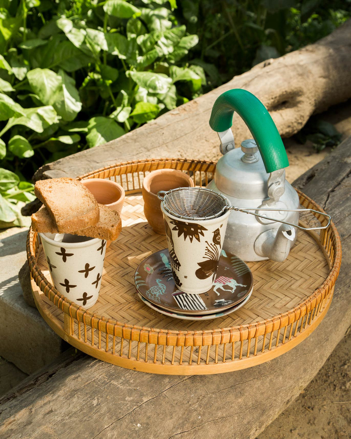 Desert Kulhar cups arranged on a woven tray.