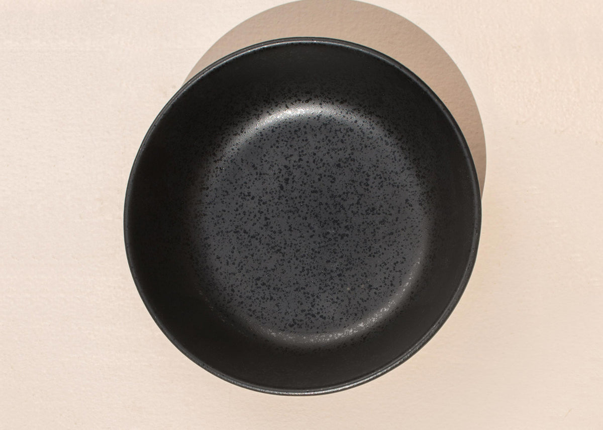 Overhead view of a Desert Dusk Pasta Plate in black.