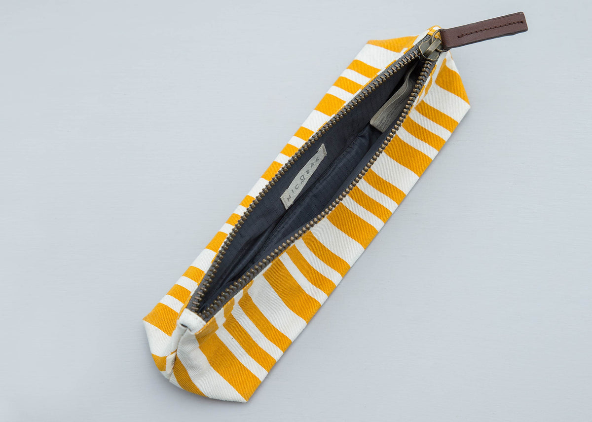 Oasis make-up pouch laid open, showing its grey lining.
