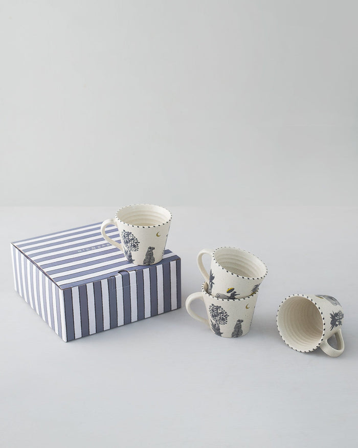 Haathi Sher Espresso Mug set of four beside a navy striped gift box.