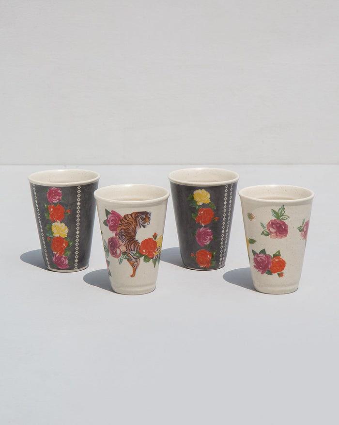 Set of four Serai kulhar cups in grey and cream with rose and tiger prints.