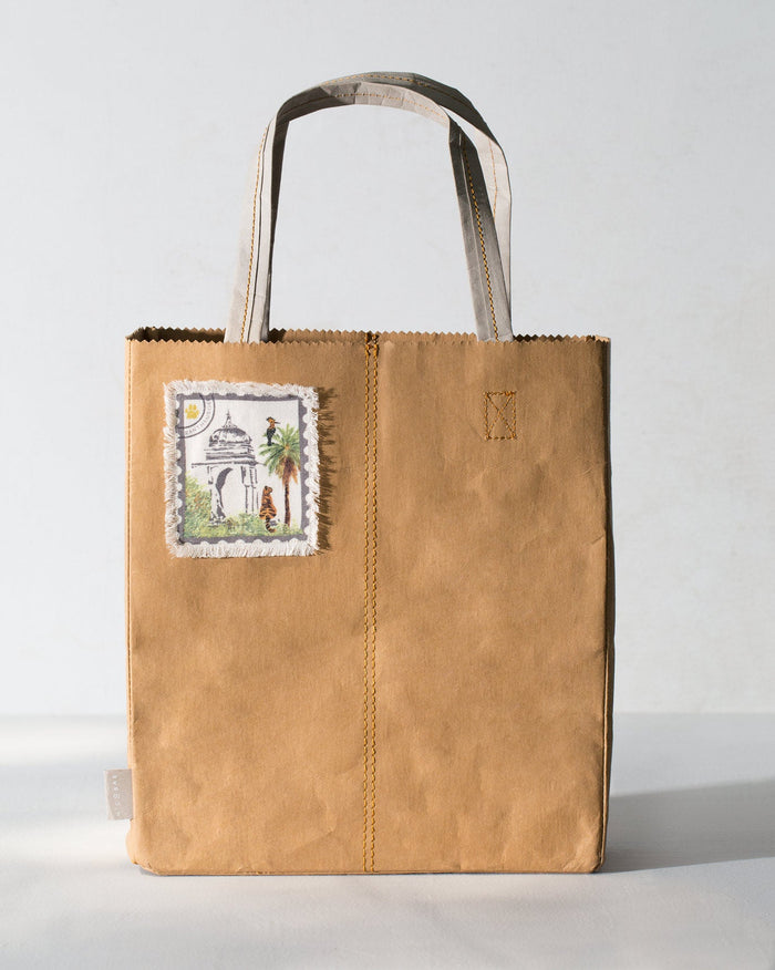 Sher Bagh Paper Tote with a stamp-style patch on the front.