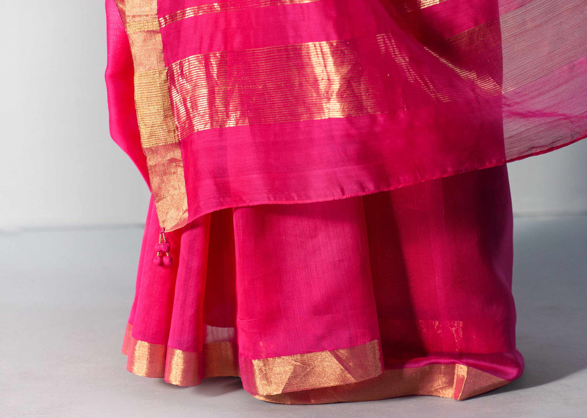 Close-up of Kimsuka Sari showing its gold-bordered hem.