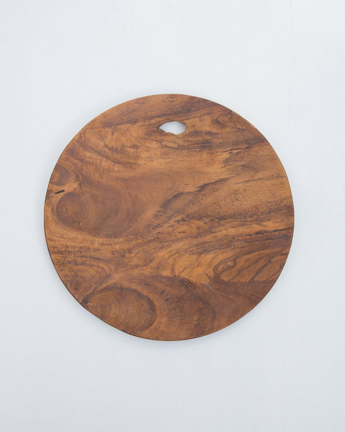 Round Serai wood platter with a handle cut-out, seen from above.