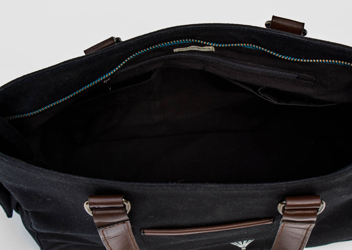 Close-up of the Perfect Work Bag open at the top, showing its black interior.