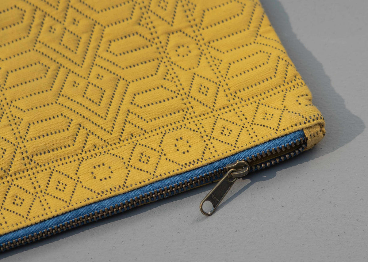 Close-up of the Midi Jacquard Pouch's blue zip and metal pull.