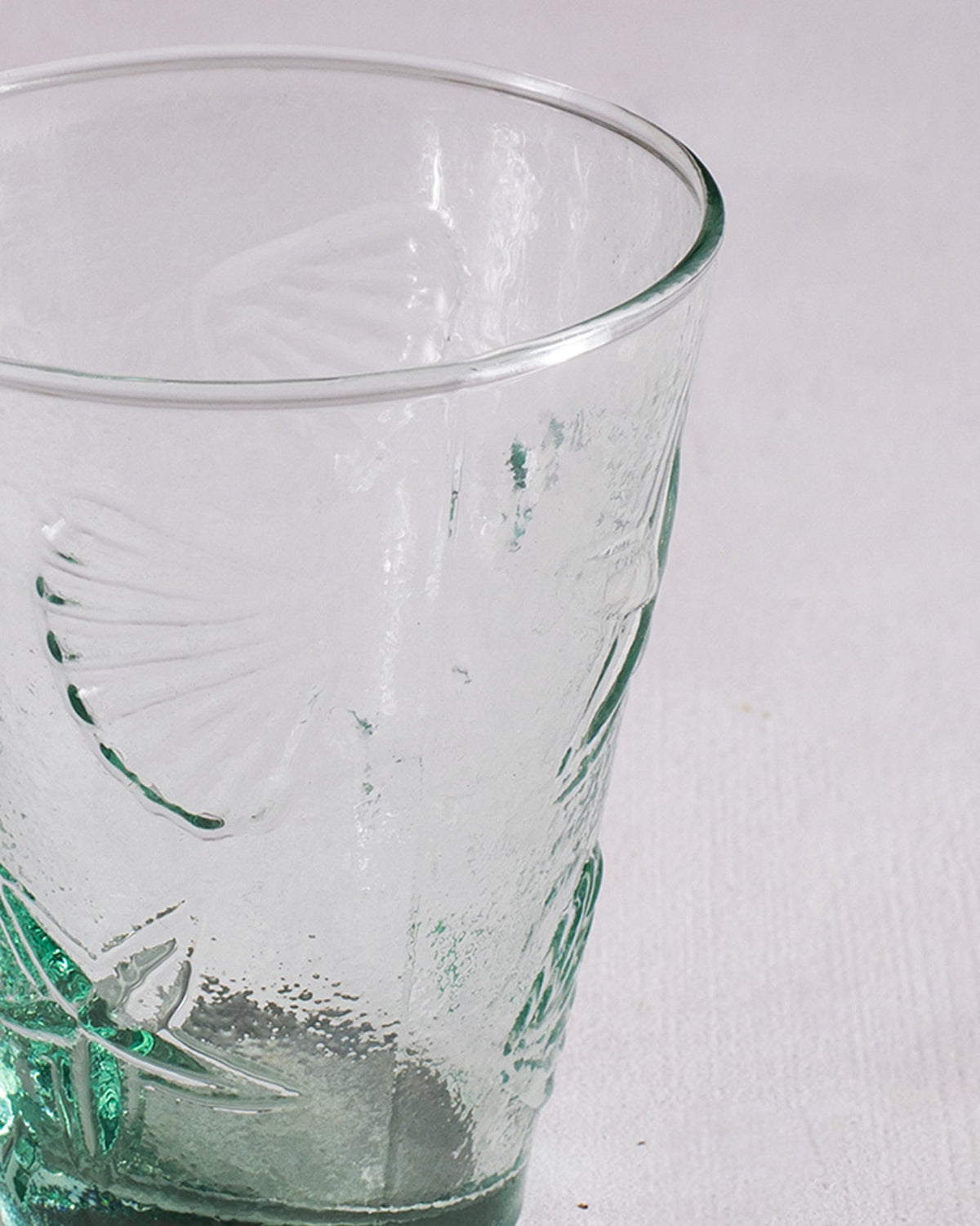 Close-up of Aire Water Tumbler showing an embossed shell motif near the rim.