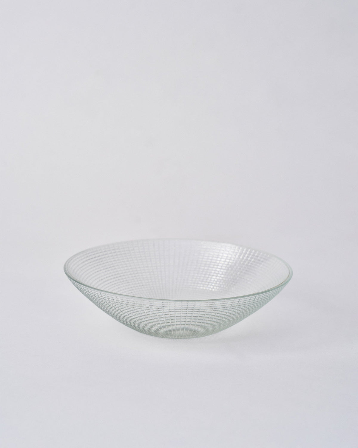 Clear Aire serving bowl with a fine geometric grid etched across the glass.