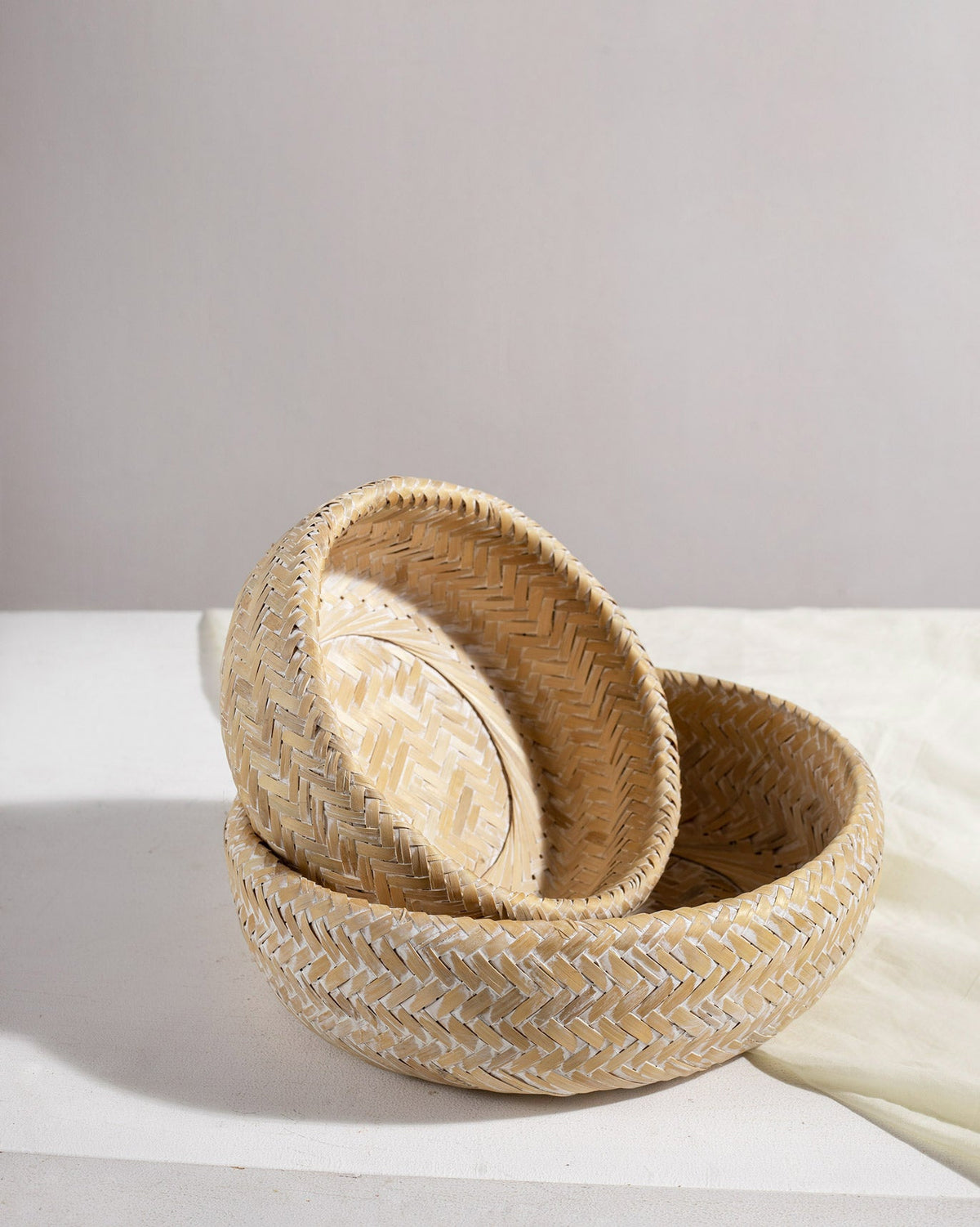 Double Walled Bamboo Fruit Baskets with one nested inside the other, shown from the side.