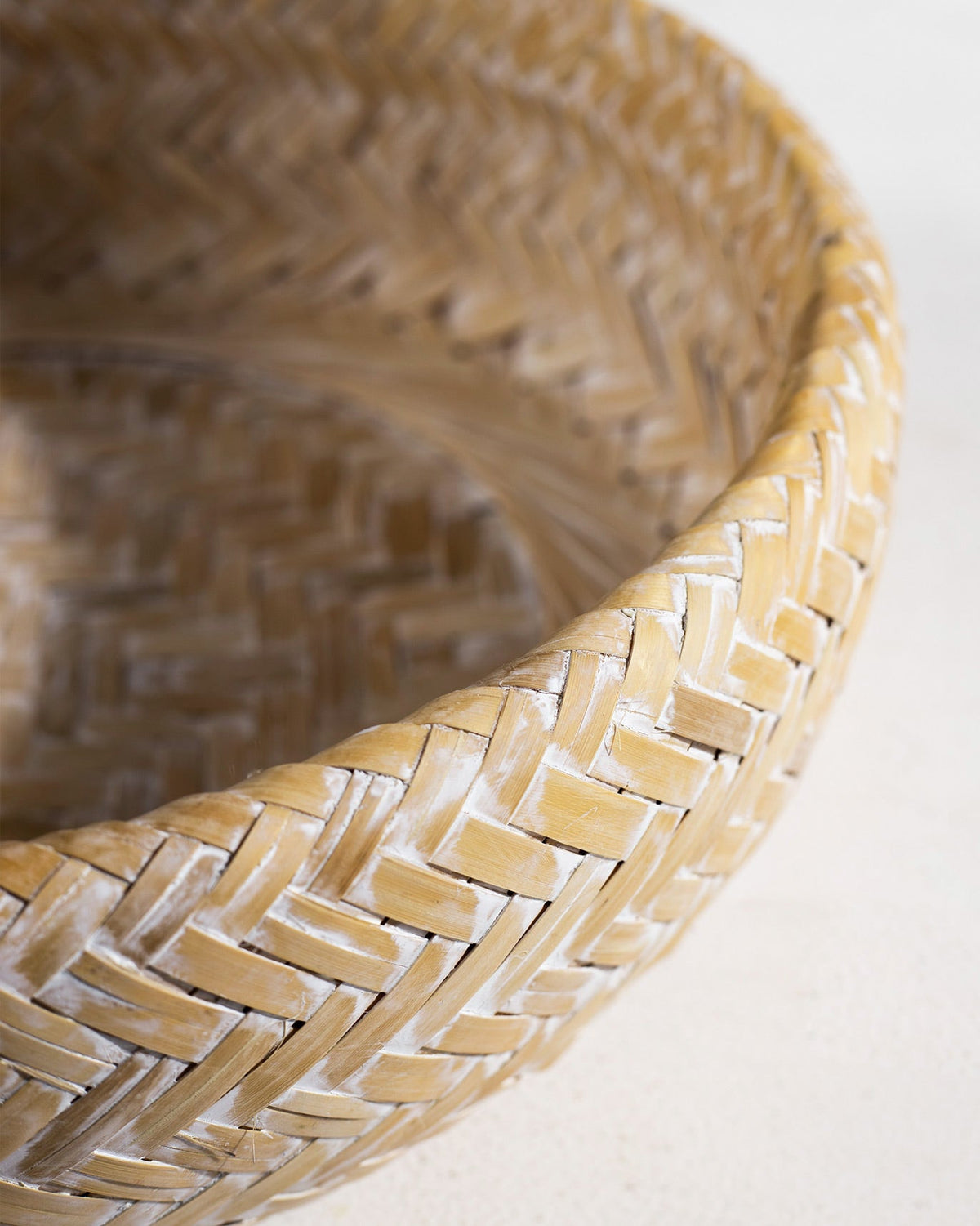 Close-up of the woven bamboo rim of a Double Walled Bamboo Fruit Basket.