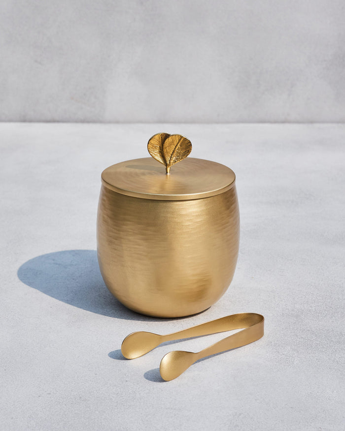 Champa gold ice bucket with leaf lid finial and matching tongs.