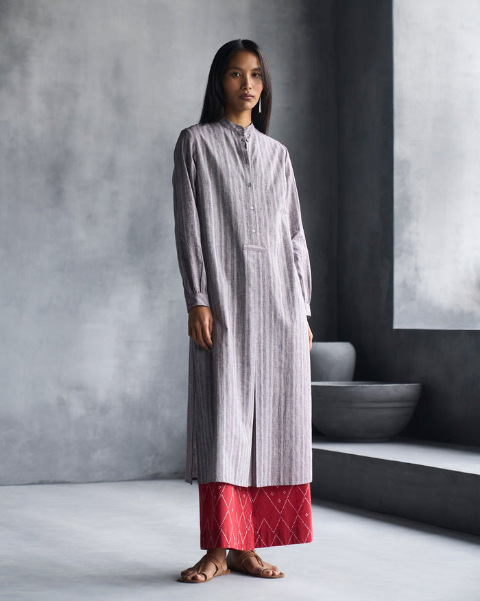 Person wearing a grey striped Mandarin Collar Kurta with a button placket.