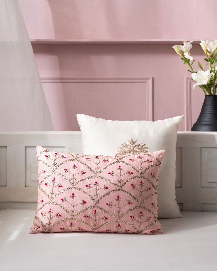 Myra Jaal Cushion Cover in pink with a gold embroidered lattice and red buds.