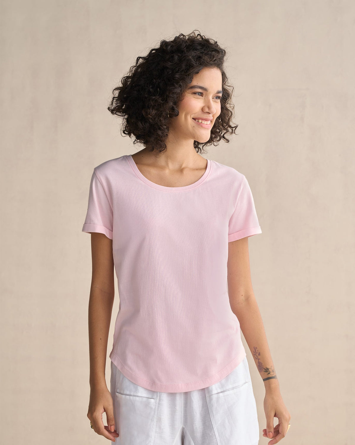 Person wearing a pink Basic T-Shirt.