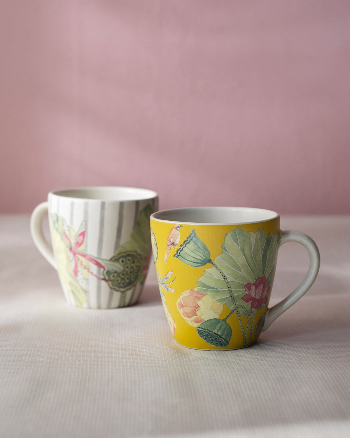 Set of two Lotus Garden mugs with lotus leaf and botanical prints.
