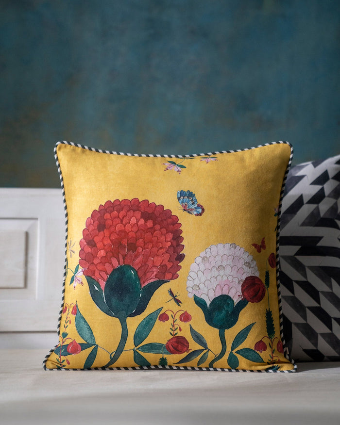 Winter Wonderland Cushion Cover in yellow with red and pink flowers.
