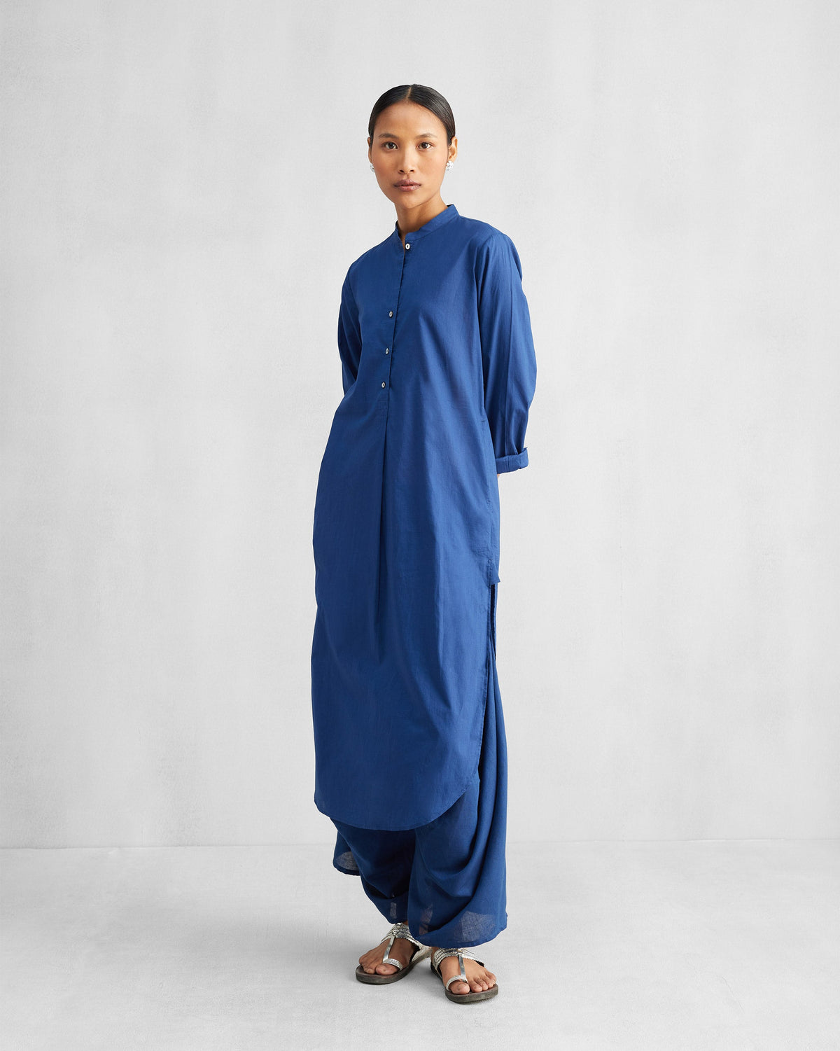Navy Yoka Trousers worn with a matching long tunic.