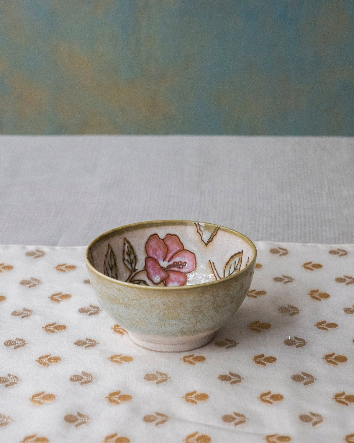 Zanzibar Katori with a pink flower and leaves painted inside.