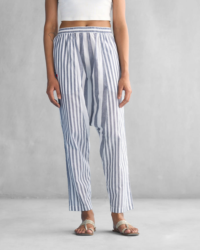 Person wearing Toddy Panelled Pants in blue and white stripes.