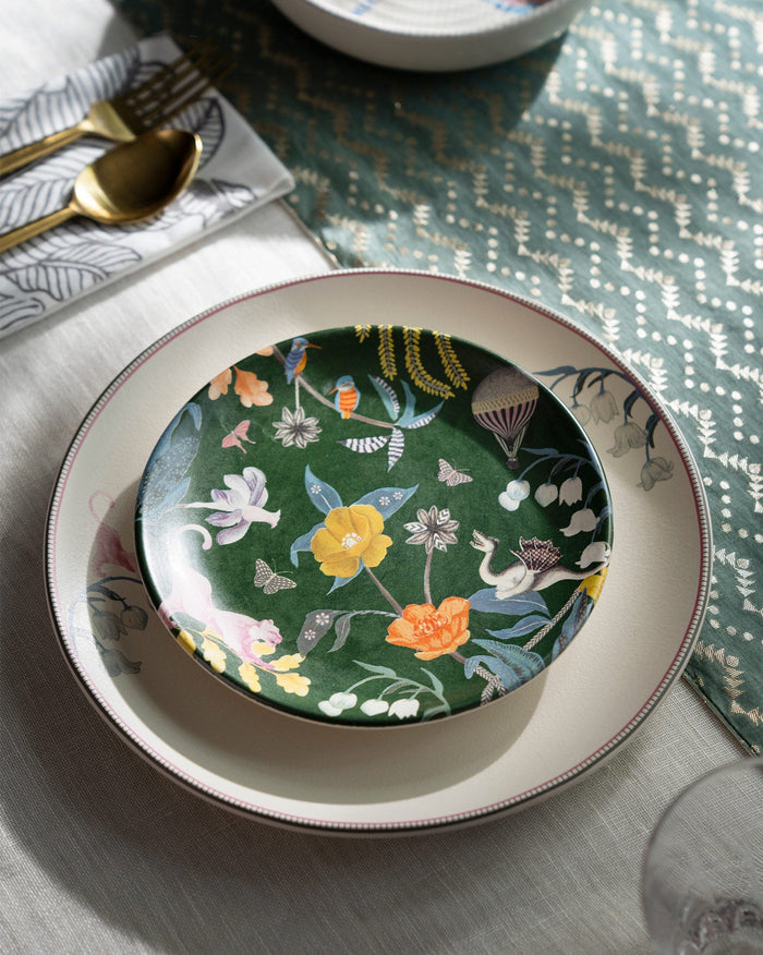 Myra Quarter Plate in emerald with birds and flowers, set on a cream plate.