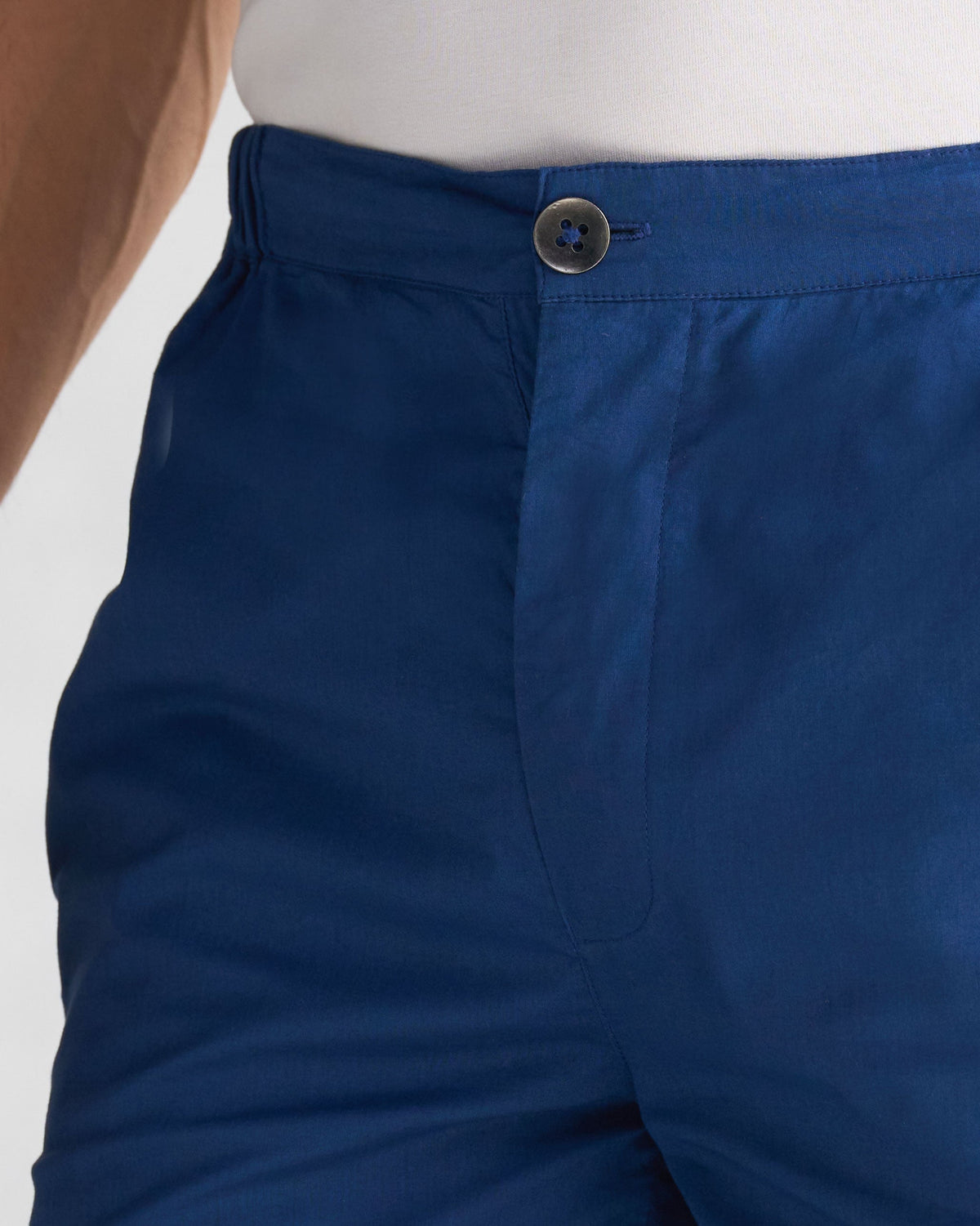 Close-up of blue Shillong Jammies showing the elastic waistband and button closure.