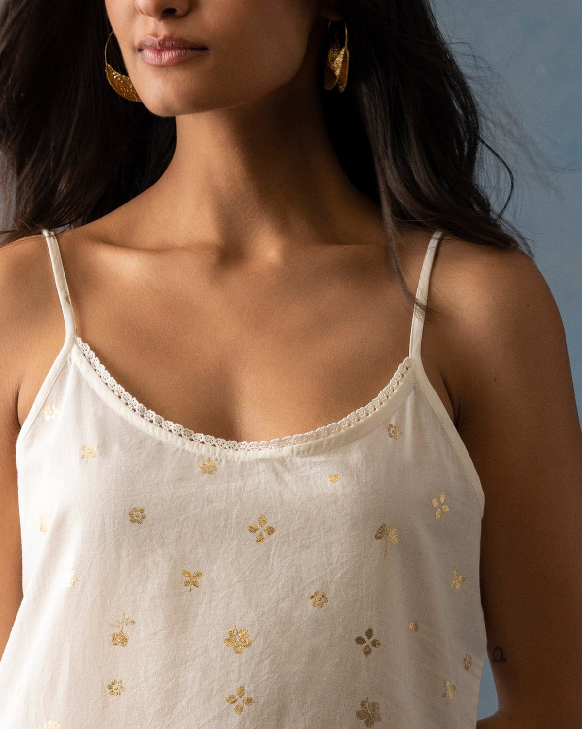 Close-up of the lace-edged neckline on an ivory Vintage Camisole Slip.