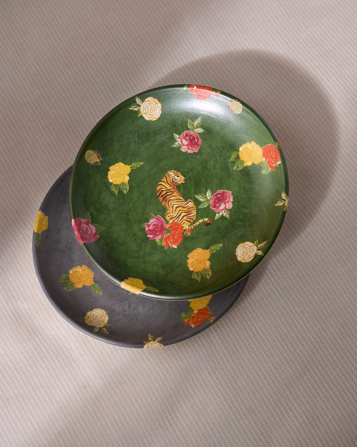 Green Tigress Quarter Plate stacked on a grey one, with tiger and rose motifs.