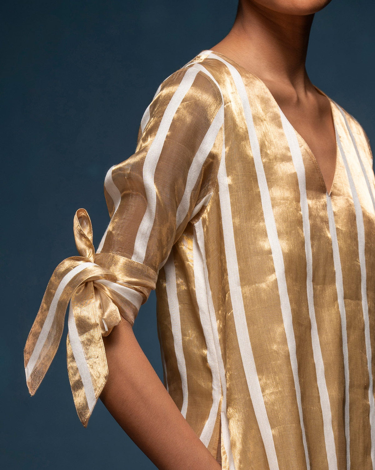 Close-up of the V-Neck Shift Dress sleeve showing a tied bow at the cuff.