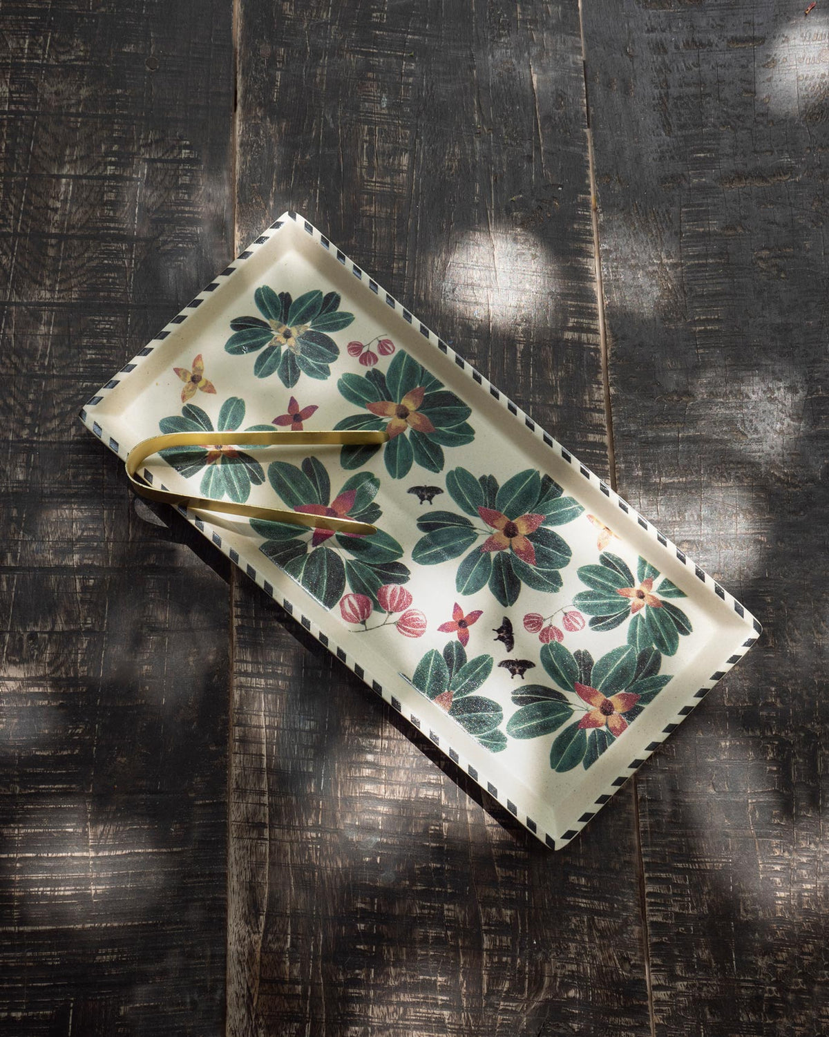 Flora Cookie Tray with Tong laid flat, showing its green floral print and gold tong.