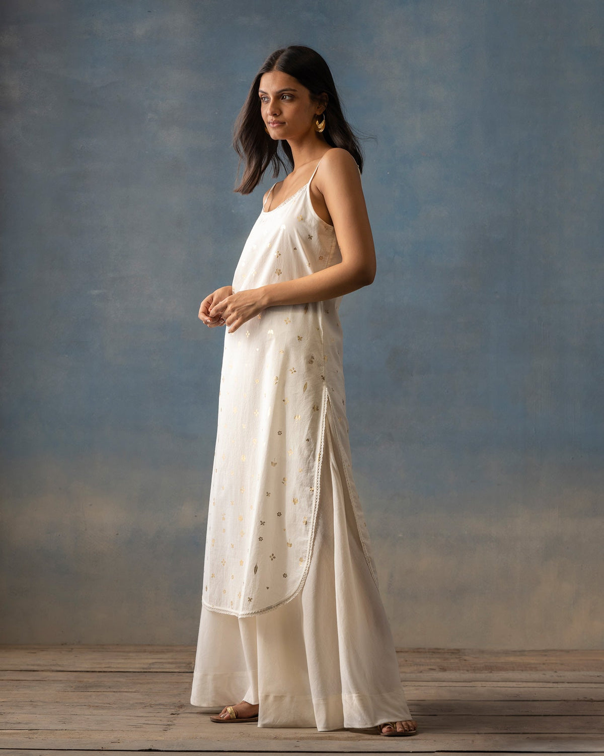 Side view of an ivory Vintage Camisole Slip worn by a person.