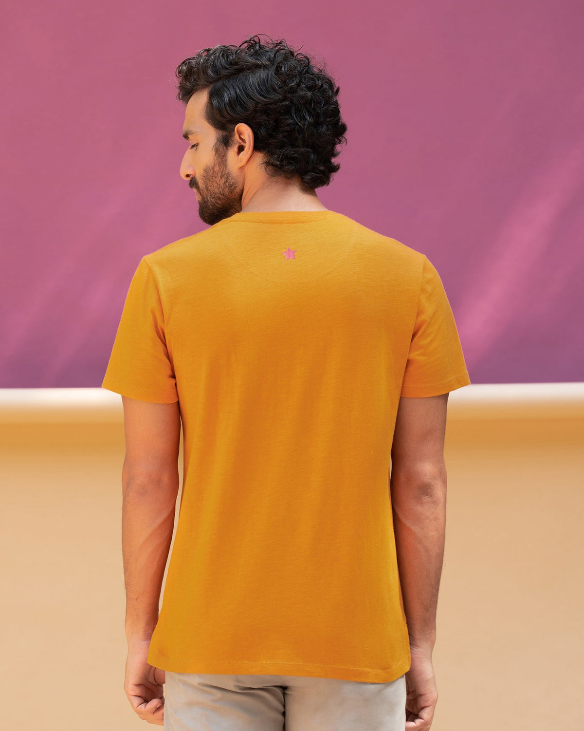 Back of the King's Queen T-shirt worn by a person.