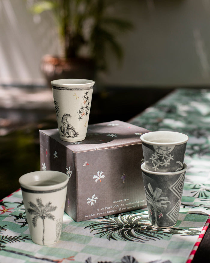 Periyar Kulhars set with a leopard cup standing on a patterned box.