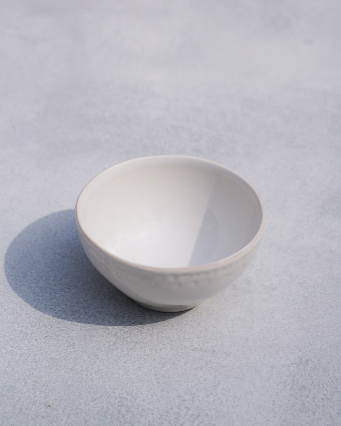 Coco Palm Katori, a small white bowl with a dotted band.
