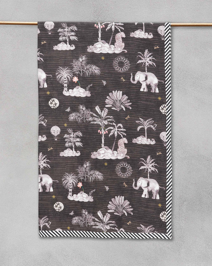 Kangra bed cover hung over a rail, showing its elephant and palm print.