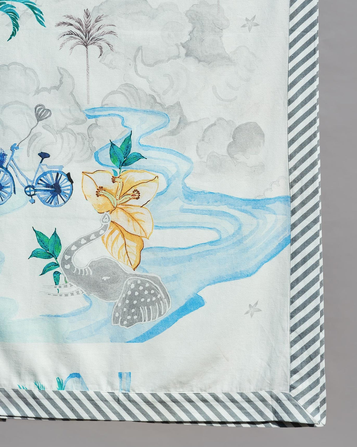 Close-up of King Bagan Bed Cover showing a bicycle, elephant and hibiscus print.