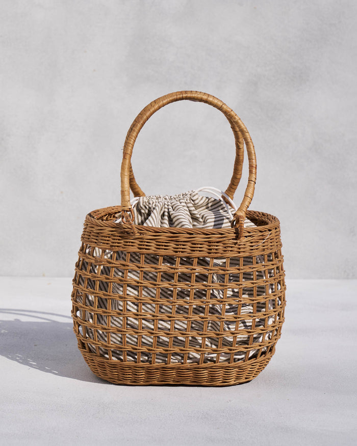 Khasi Lunch Basket with two handles and a striped pouch inside.