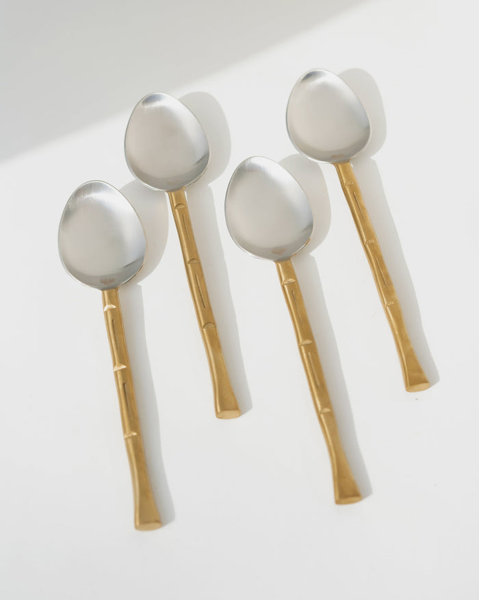 Horizon Spoon (Set of 4) with silver bowls and gold-toned segmented handles.